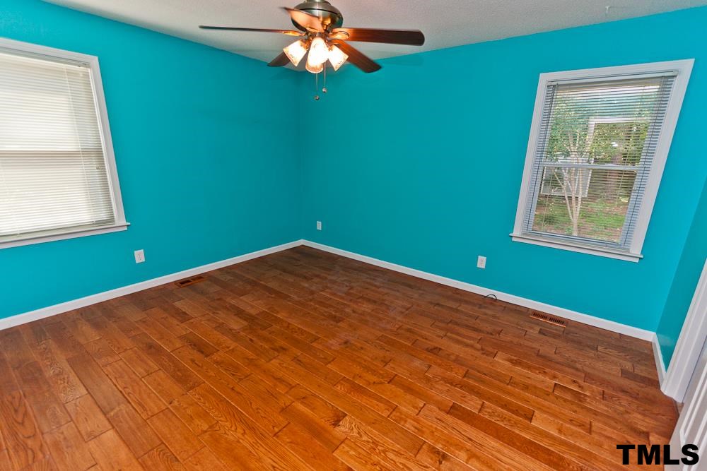 4305 Hopson Drive Raleigh, NC 27604 - Photo 6 of 14 Owner's suite with beautiful flooring, ceiling fan.
