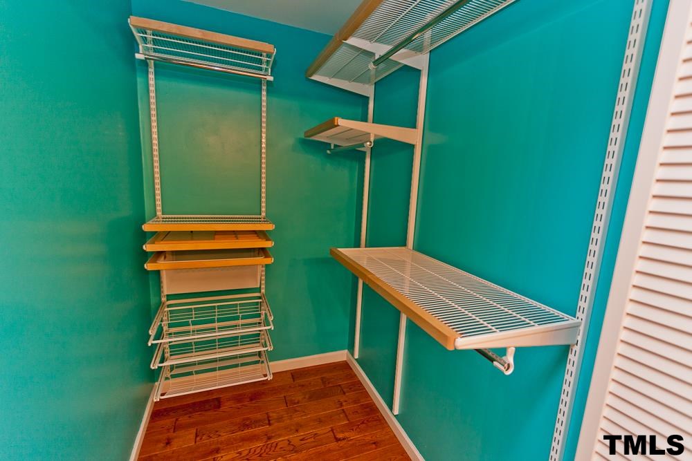 4305 Hopson Drive Raleigh, NC 27604 - Photo 7 of 14 Owner's suite walk in closet with custom shelving.