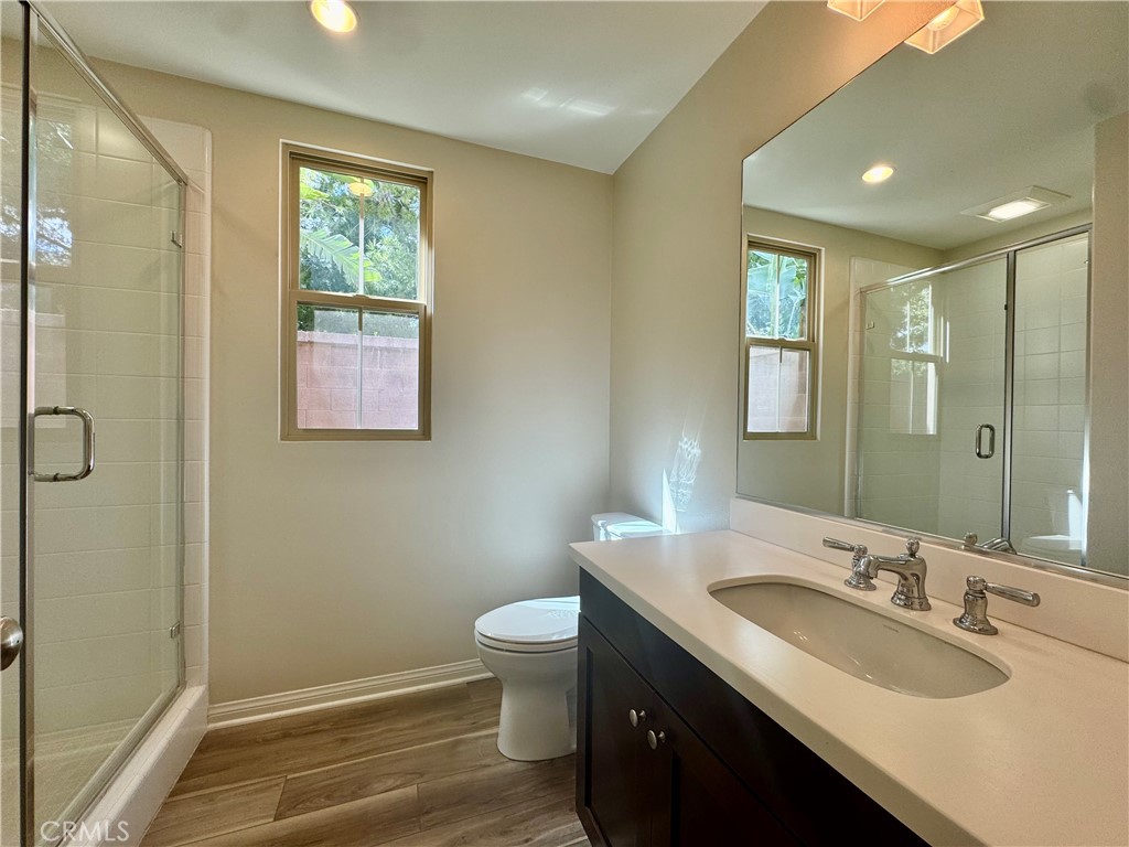51 Elmdale Irvine, CA 92620 - Photo 16 of 41 a bathroom with a granite countertop sink toilet and shower