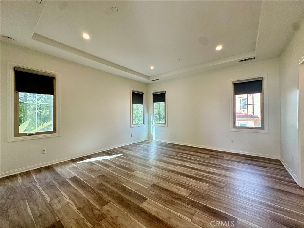 51 Elmdale Irvine, CA 92620 - Photo 21 of 41 a view of an empty room with wooden floor and a window