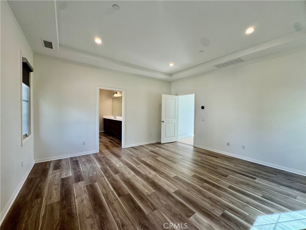 51 Elmdale Irvine, CA 92620 - Photo 22 of 41 a view of empty room with wooden floor and fireplace