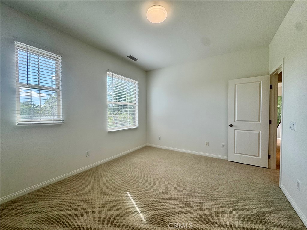 51 Elmdale Irvine, CA 92620 - Photo 30 of 41 an empty room with windows and closet