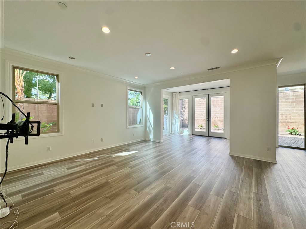 51 Elmdale Irvine, CA 92620 - Photo 5 of 41 a view of an empty room with wooden floor and a window