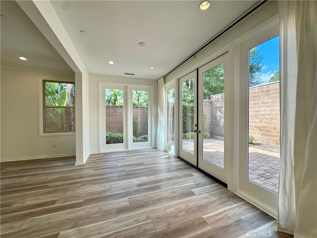51 Elmdale Irvine, CA 92620 - Photo 8 of 41 a view of an entryway with wooden floor and door