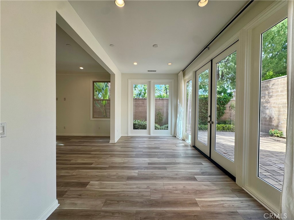 51 Elmdale Irvine, CA 92620 - Photo 9 of 41 a view of an empty room with wooden floor and a window
