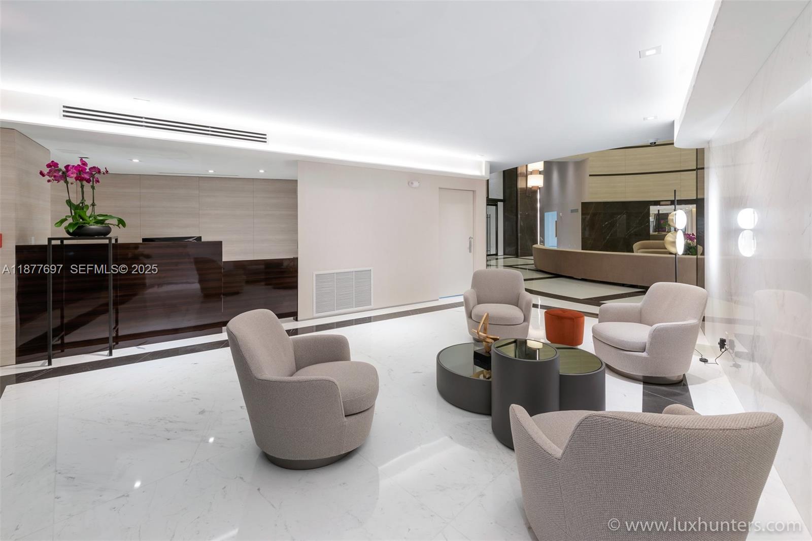 300 South Pointe Drive, Unit 2806 Miami Beach, FL 33139 - Photo 18 of 68 a living room with furniture and a flat screen tv