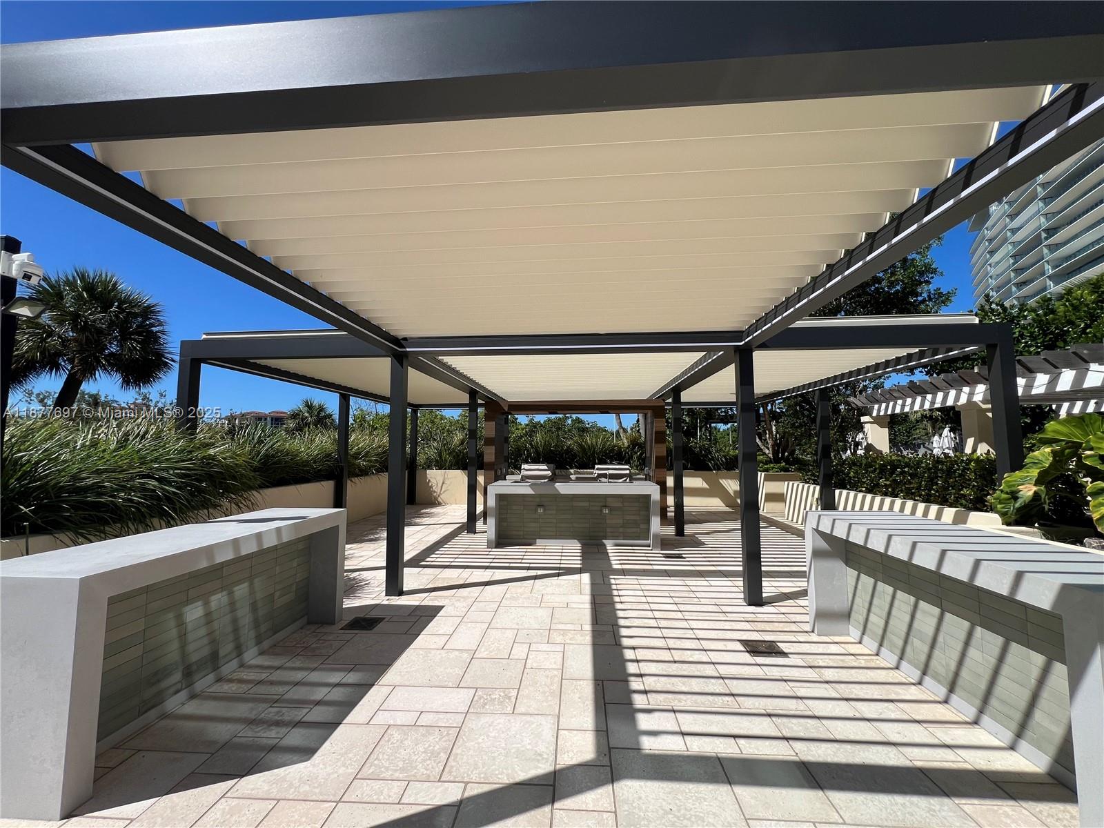 300 South Pointe Drive, Unit 2806 Miami Beach, FL 33139 - Photo 36 of 68 a view of a patio with a table and chairs