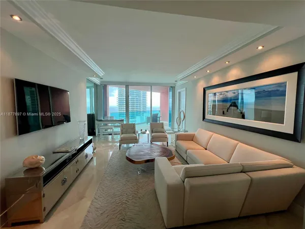 a living room with furniture rug and window