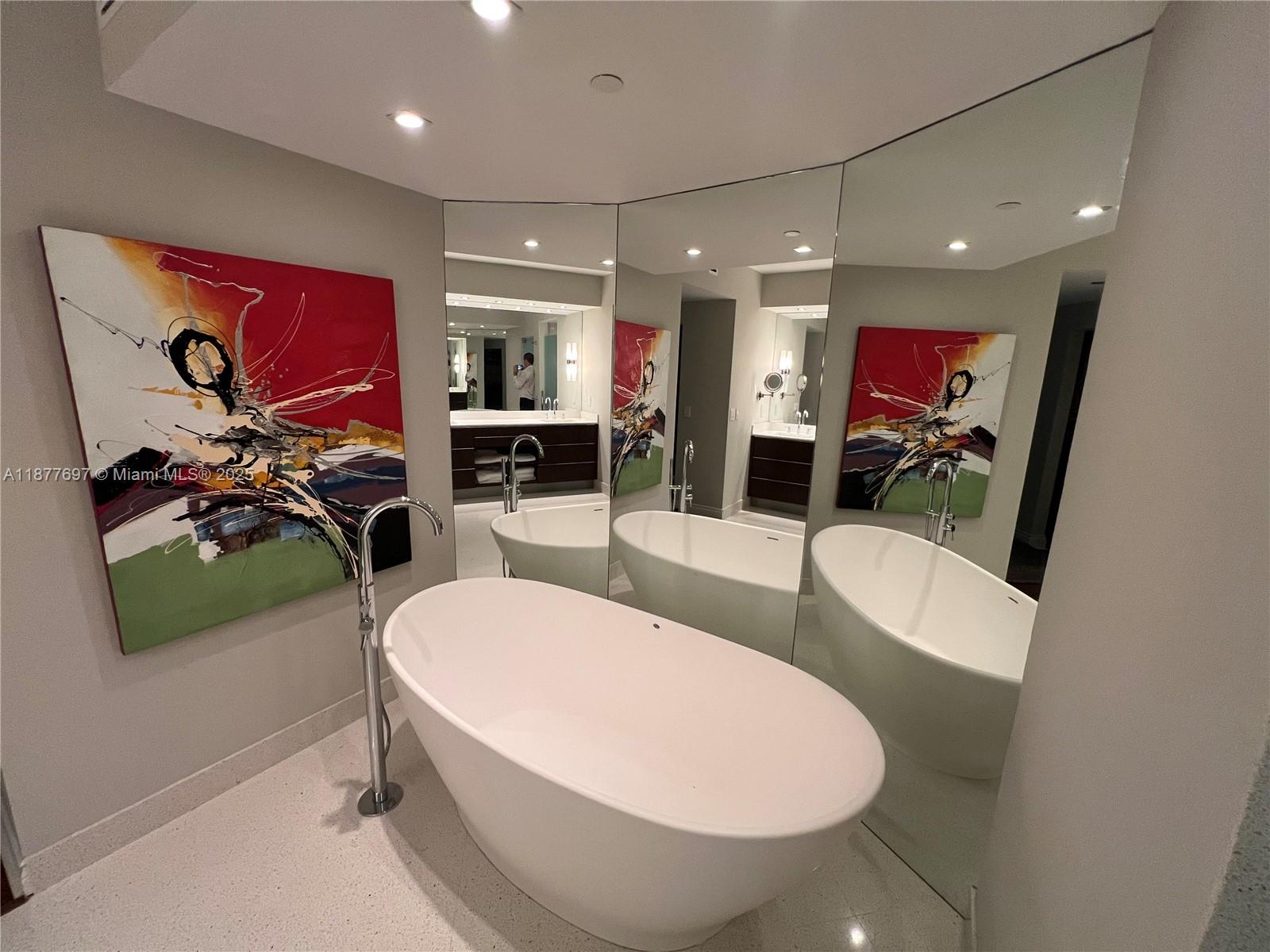 300 South Pointe Drive, Unit 2806 Miami Beach, FL 33139 - Photo 9 of 68 a view of a dining room with furniture one side kitchen view and wooden floor