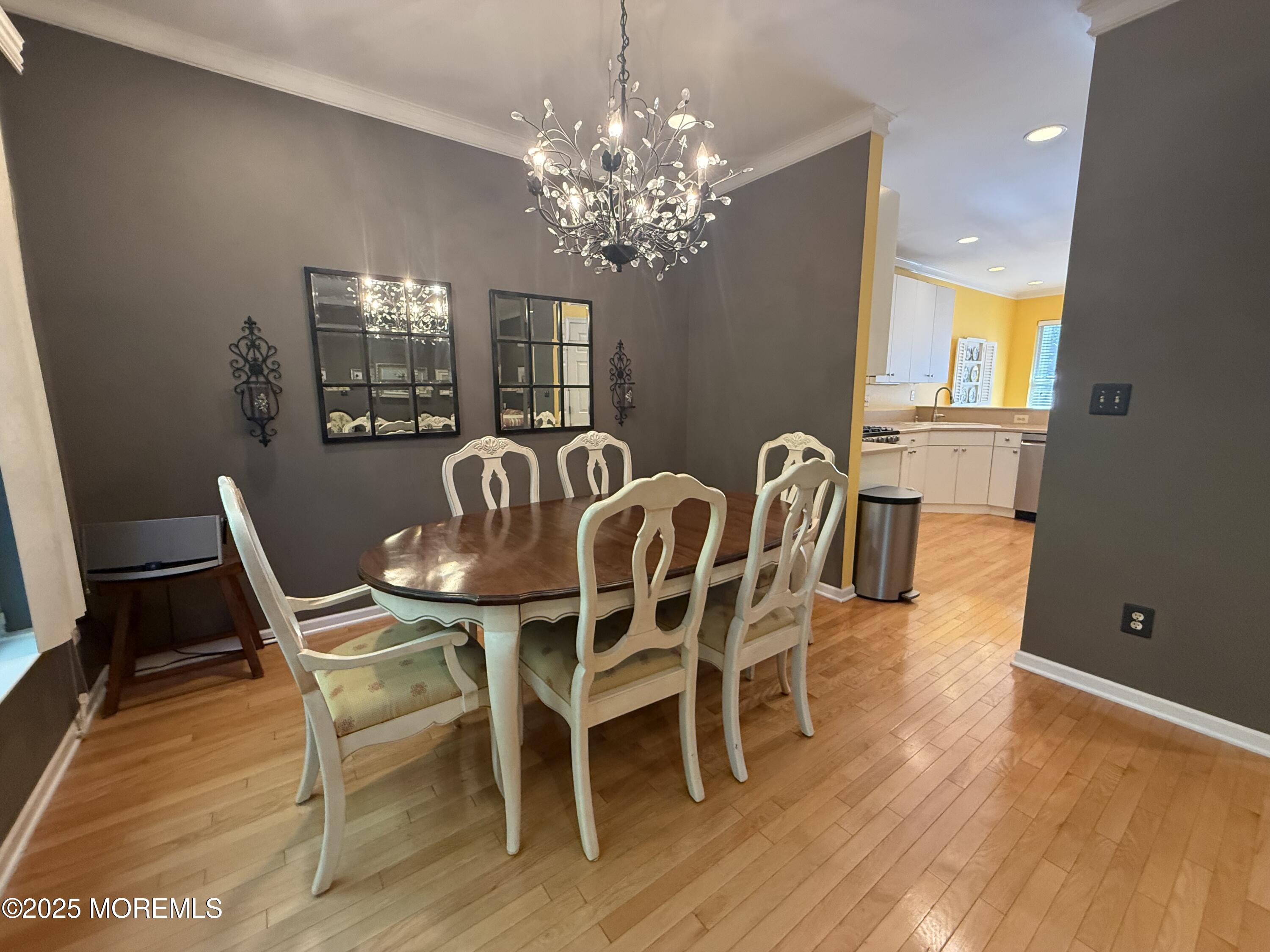 4 Pine Tree Terrace Holmdel, NJ 07733 - Photo 12 of 35 a view of a dining room with furniture wooden floor and chandelier