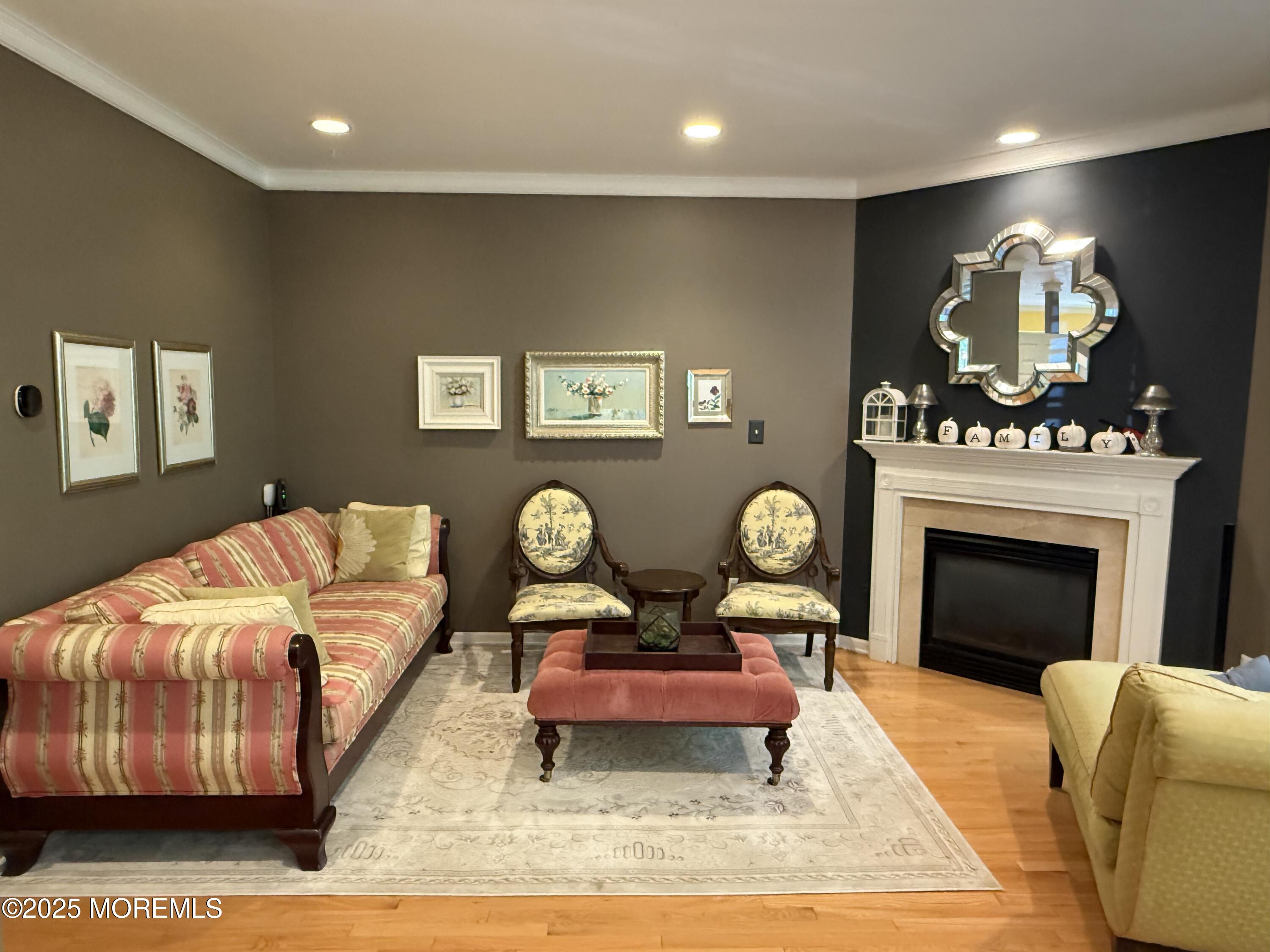 4 Pine Tree Terrace Holmdel, NJ 07733 - Photo 14 of 35 a living room with furniture a rug and a fireplace