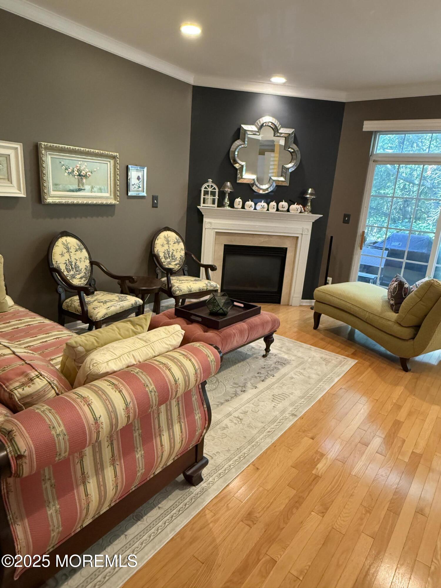 4 Pine Tree Terrace Holmdel, NJ 07733 - Photo 15 of 35 a bed room with a bed and a fireplace