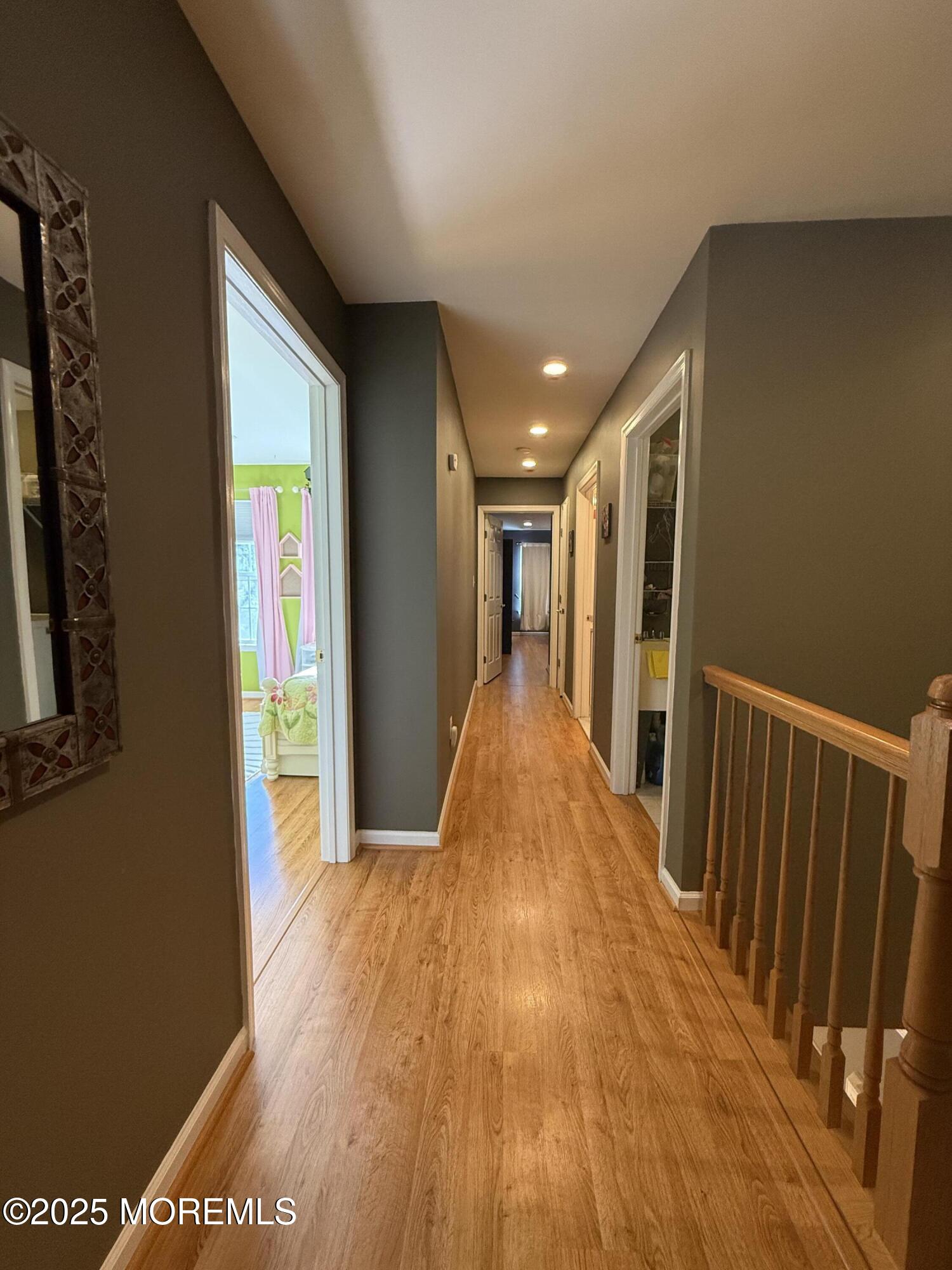 4 Pine Tree Terrace Holmdel, NJ 07733 - Photo 20 of 35 a view of a hallway with wooden floor