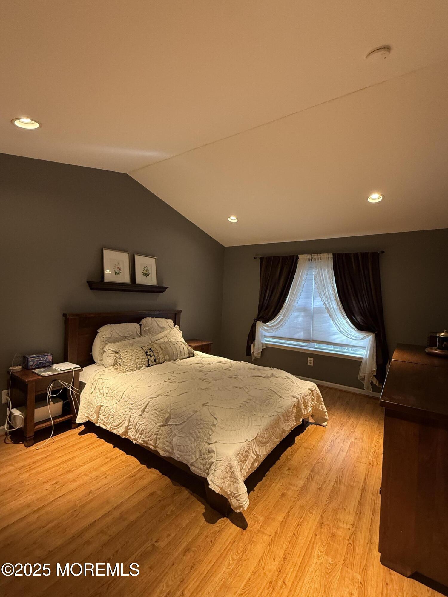 4 Pine Tree Terrace Holmdel, NJ 07733 - Photo 21 of 35 a bedroom with a bed and a night stand