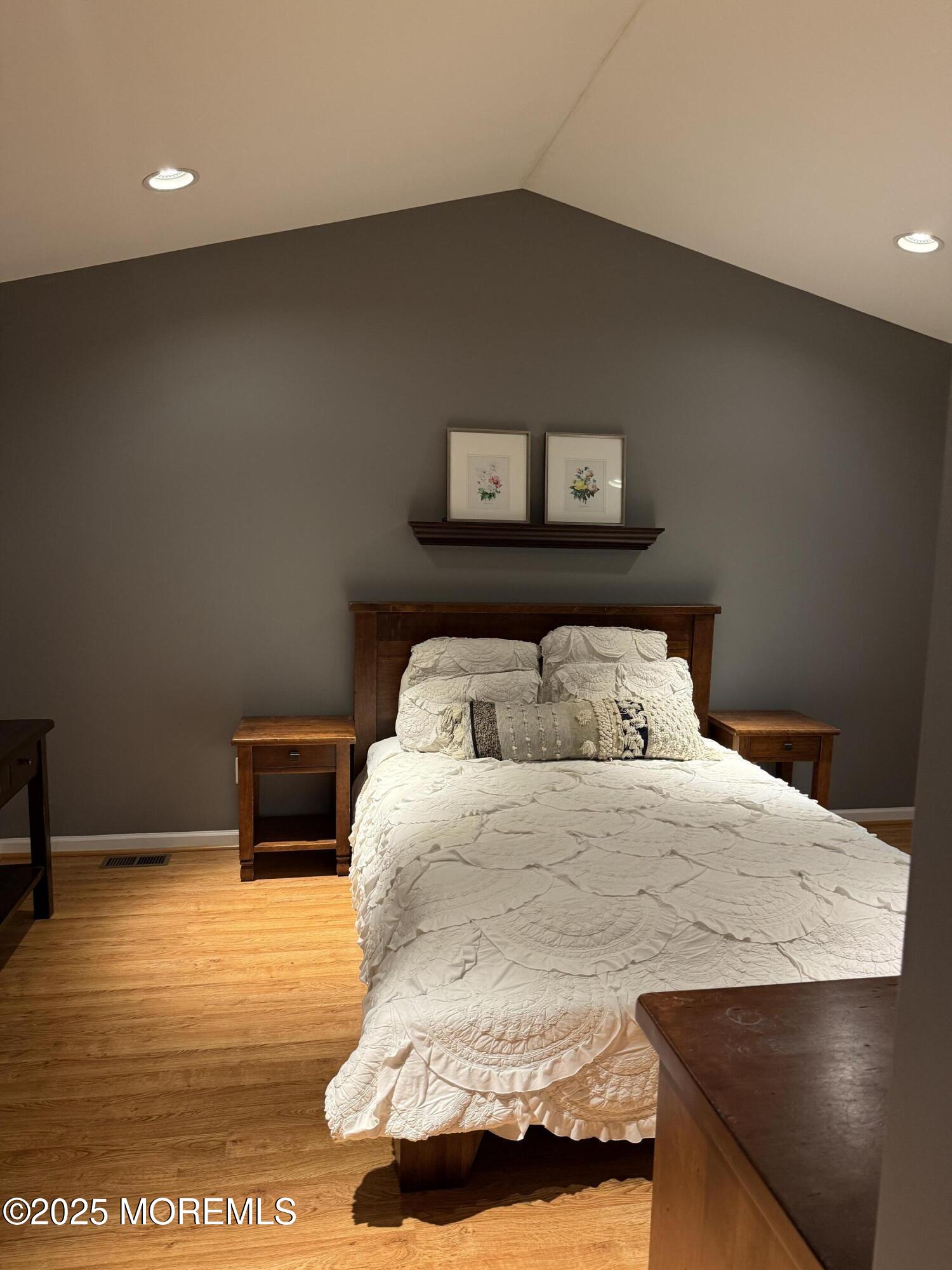 4 Pine Tree Terrace Holmdel, NJ 07733 - Photo 22 of 35 a bedroom with a bed and a night stand