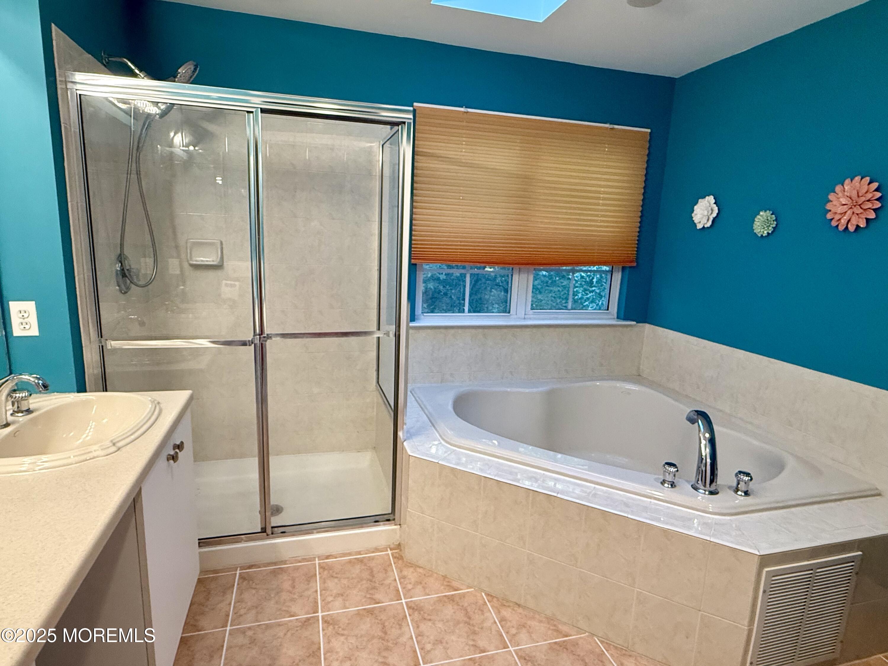 4 Pine Tree Terrace Holmdel, NJ 07733 - Photo 23 of 35 a bathroom with a tub and a sink
