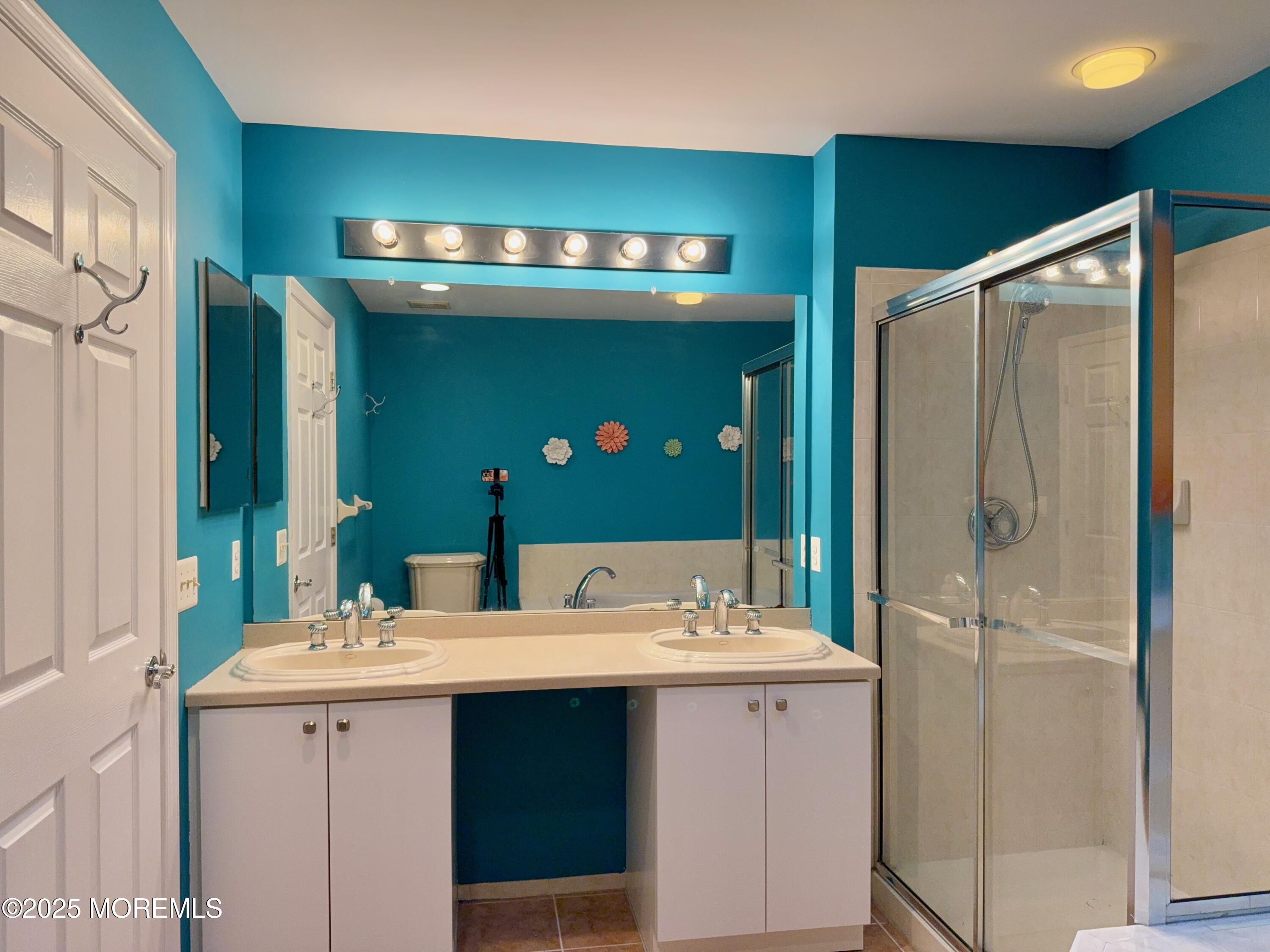 4 Pine Tree Terrace Holmdel, NJ 07733 - Photo 24 of 35 a bathroom with a sink double vanity and a mirror