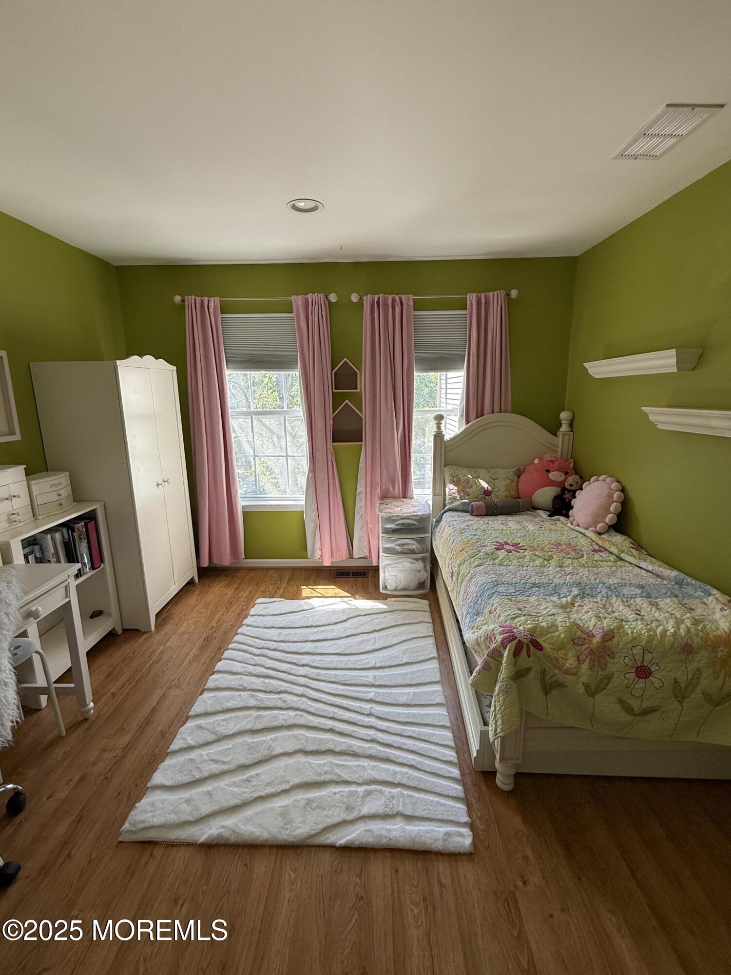 4 Pine Tree Terrace Holmdel, NJ 07733 - Photo 25 of 35 a bedroom with a large bed and a dresser