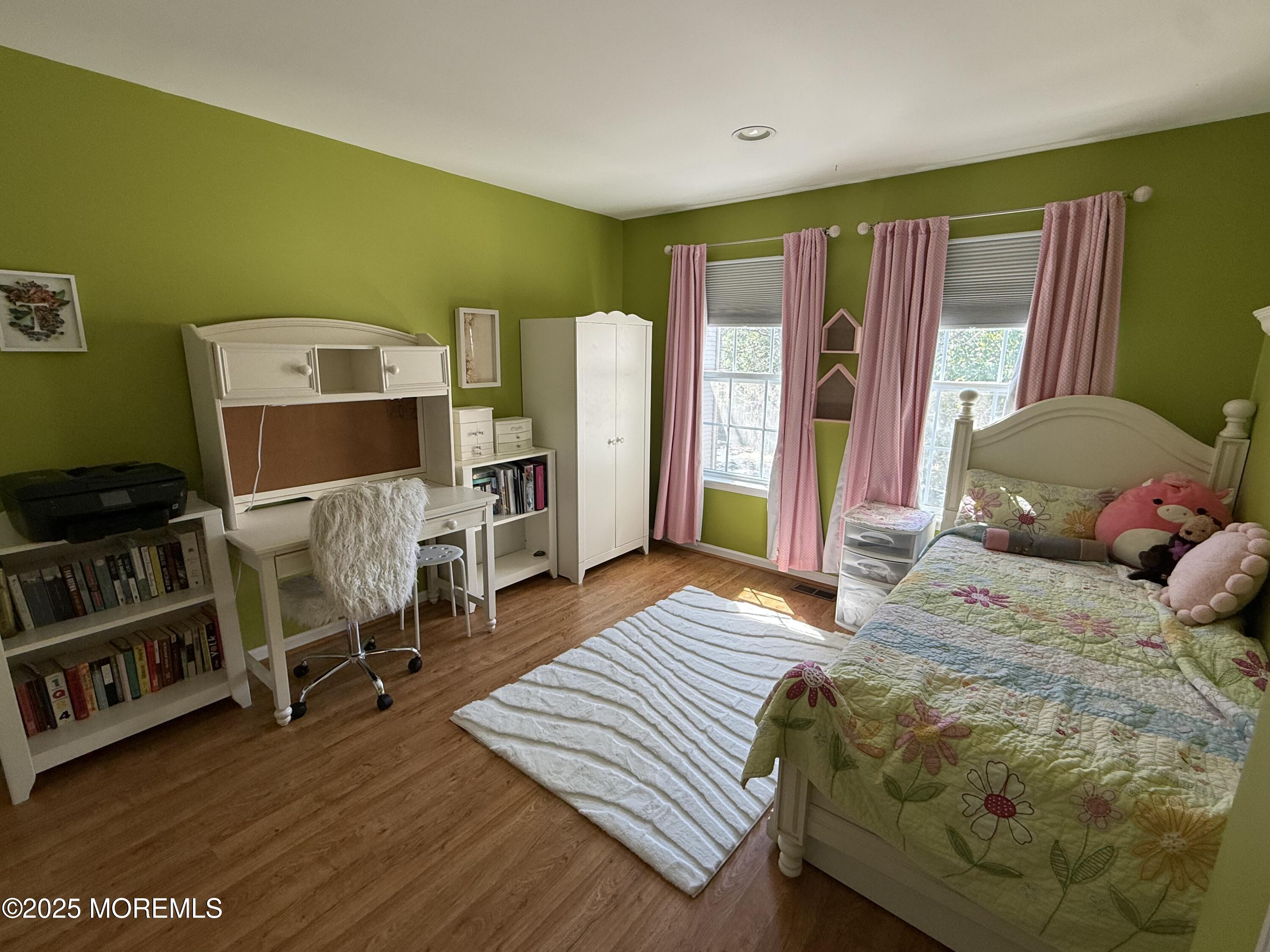 4 Pine Tree Terrace Holmdel, NJ 07733 - Photo 26 of 35 a bedroom with a bed and wooden floor