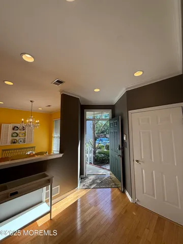 a view of a room with a furniture and floor to ceiling window