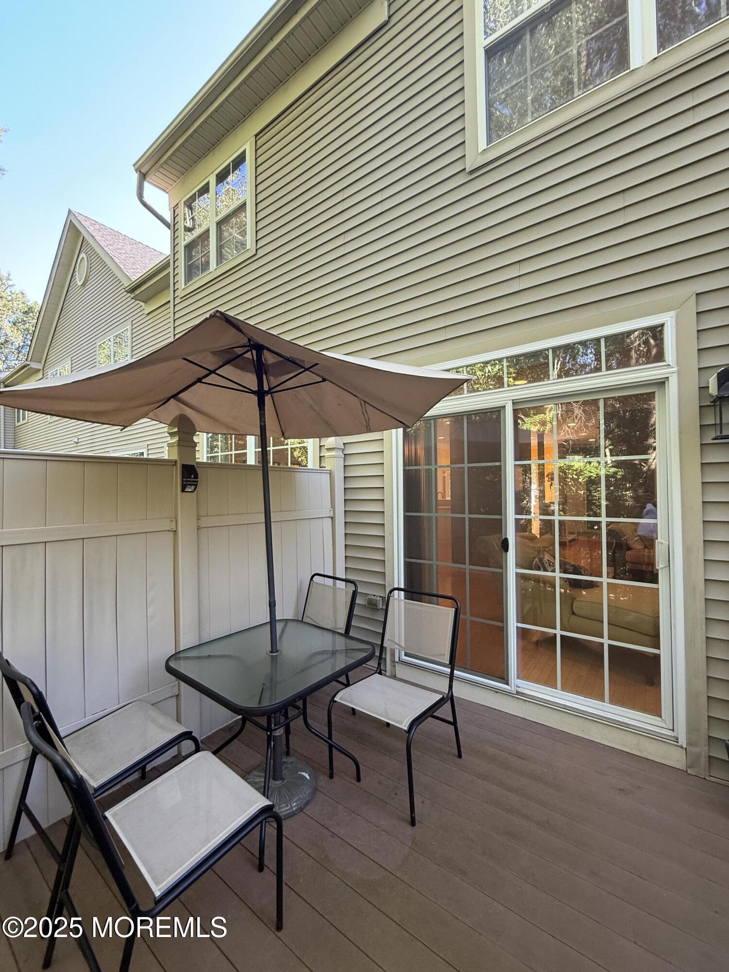 4 Pine Tree Terrace Holmdel, NJ 07733 - Photo 34 of 35 a backyard of a house with table and chairs
