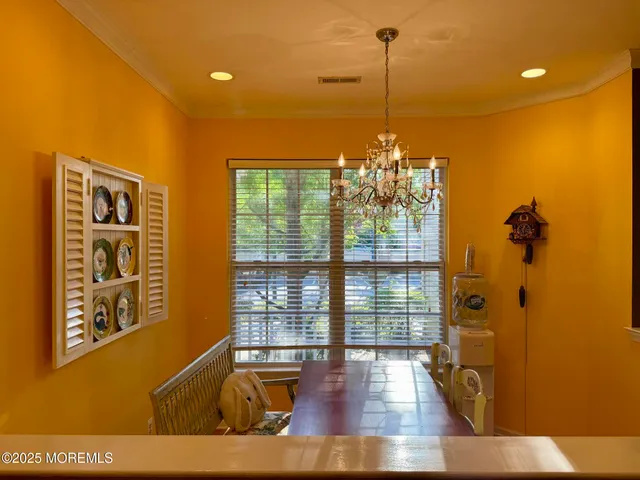 a view of a living room with furniture and a window