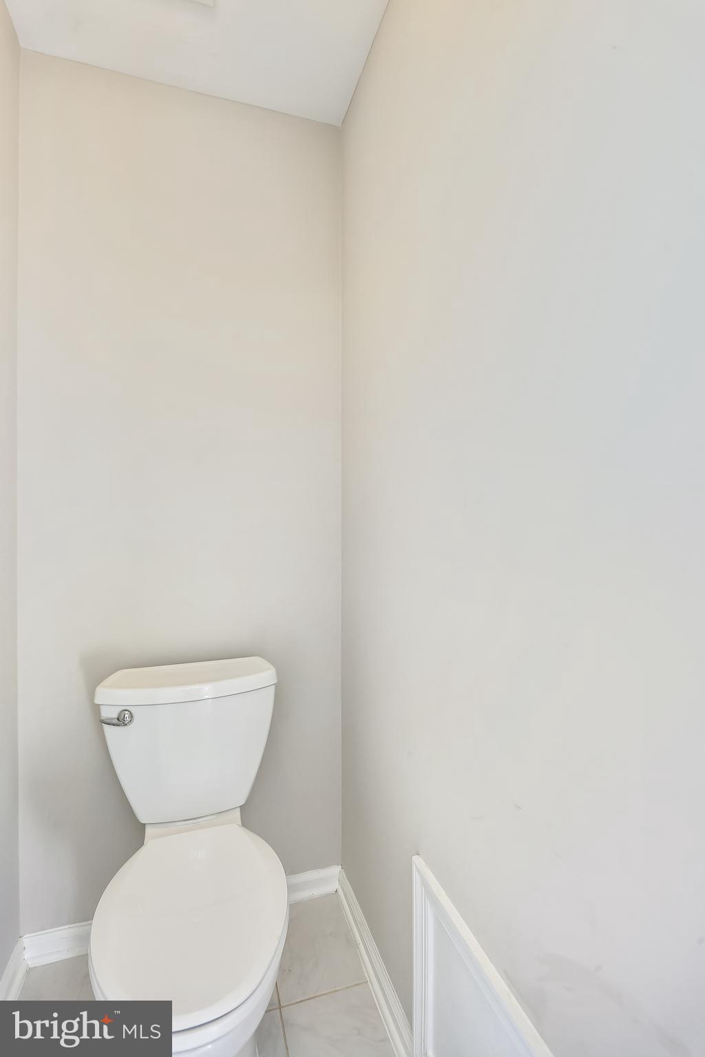 9517 Greenel Road Damascus, MD 20872 - Photo 57 of 98 a white toilet sitting next to a white wall