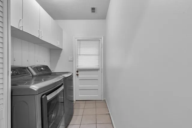 a kitchen with a stove and a refrigerator