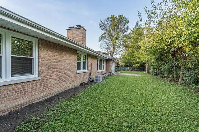 a backyard of a house with lots of green space