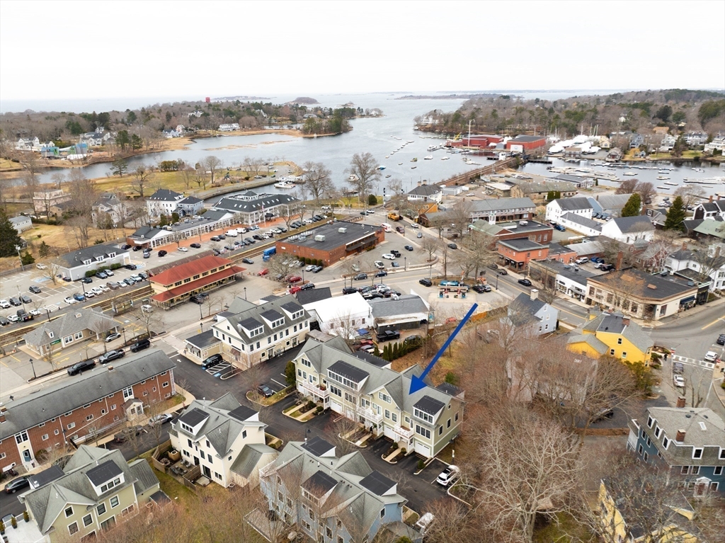 6 Summer Street, Unit D Manchester, MA 01944 - Photo 2 of 31 an aerial view of residential houses with outdoor space
