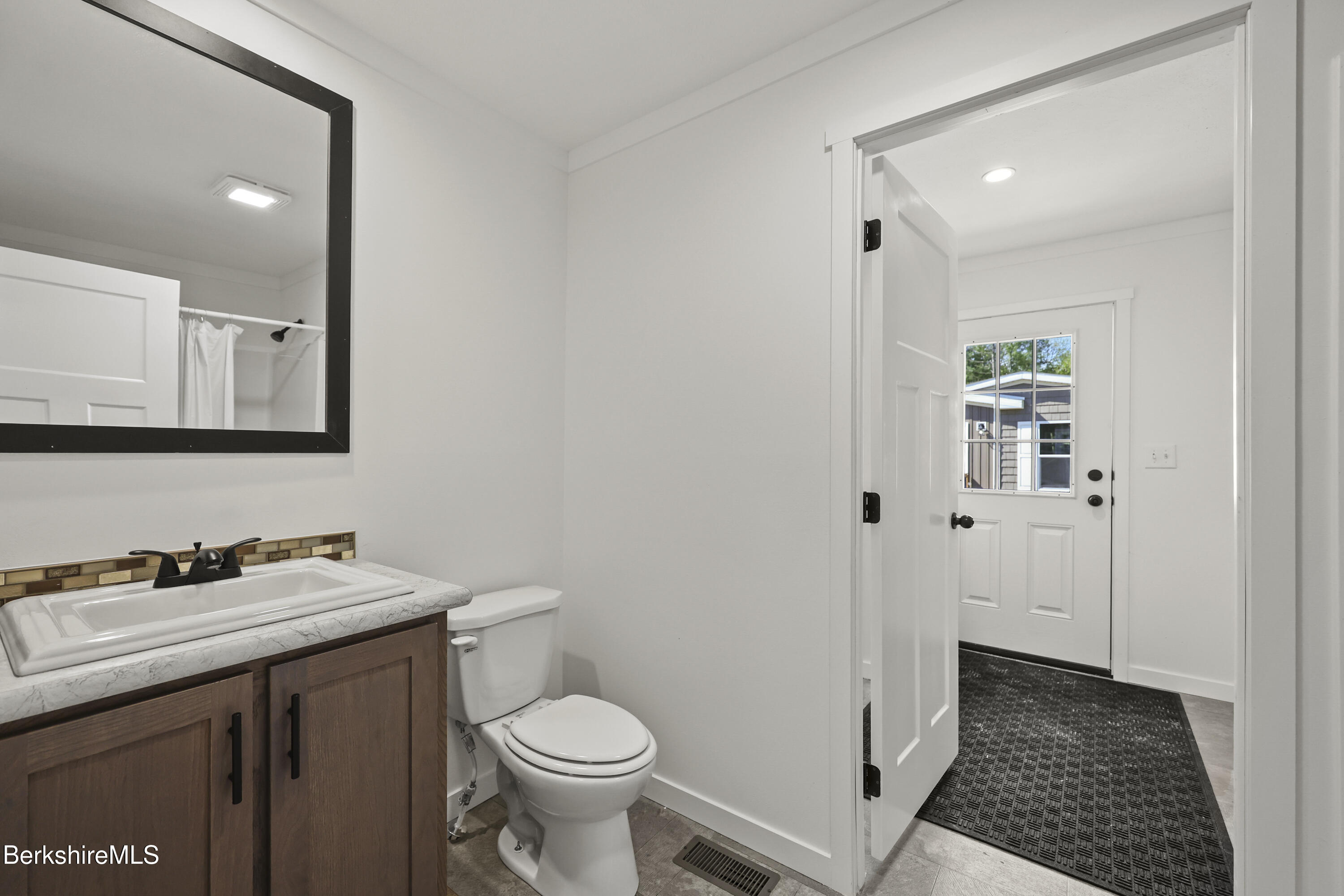395 Cheshire Road, Unit 102 Pittsfield, MA 01201 - Photo 26 of 28 a bathroom with a sink and a toilet
