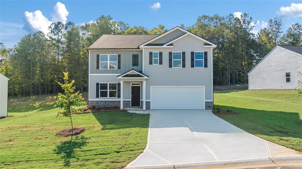 1191 Amerson Street Buckhead, GA 30625 - Photo 1 of 96 a front view of a house with a yard