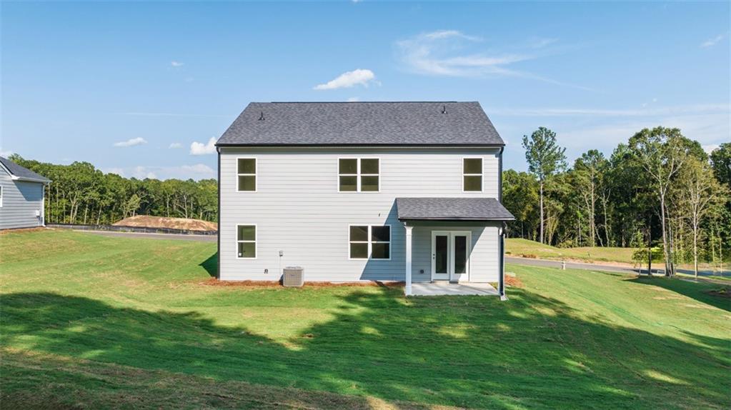 1191 Amerson Street Buckhead, GA 30625 - Photo 2 of 96 a front view of house with yard and green space