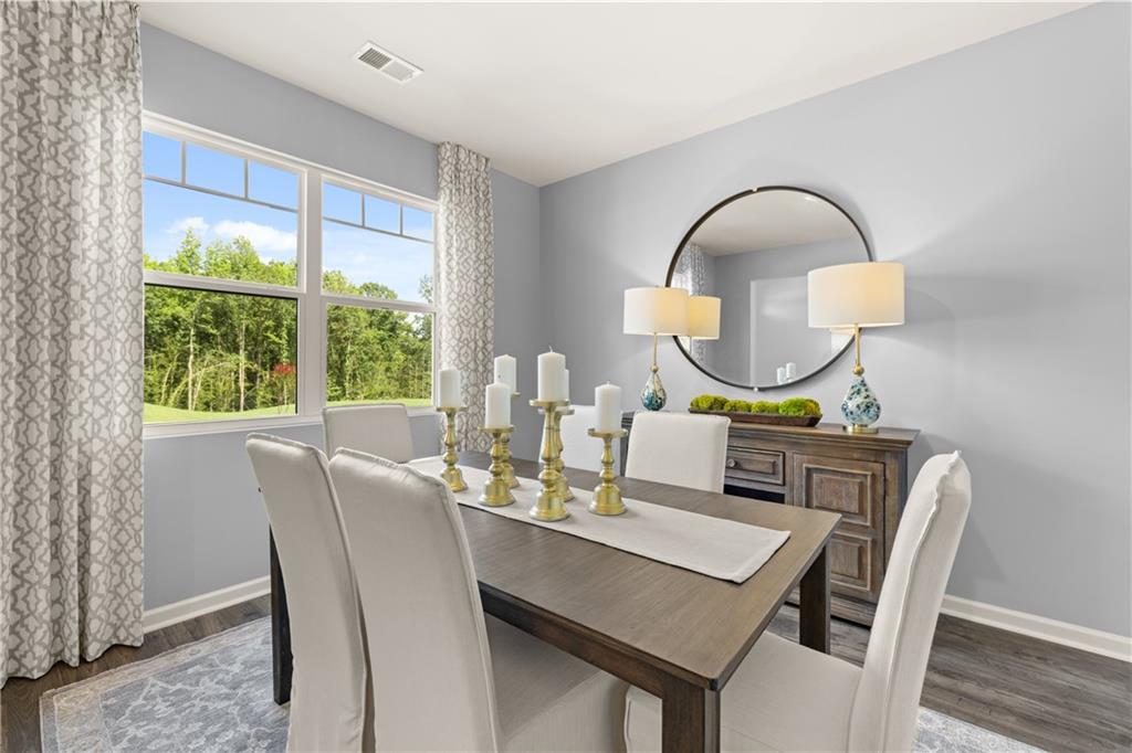 1191 Amerson Street Buckhead, GA 30625 - Photo 25 of 96 a view of a dining room with furniture window and wooden floor