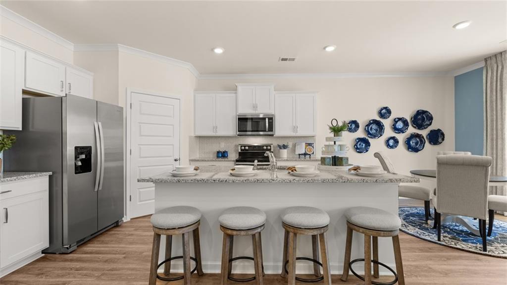 1191 Amerson Street Buckhead, GA 30625 - Photo 30 of 96 a kitchen with stainless steel appliances granite countertop a sink and a refrigerator