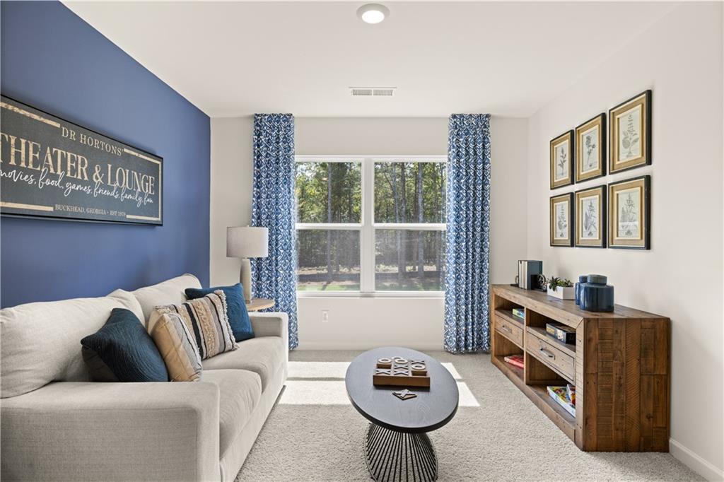 1191 Amerson Street Buckhead, GA 30625 - Photo 60 of 96 a living room with furniture and a floor to ceiling window
