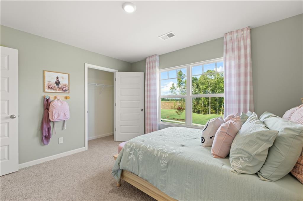 1191 Amerson Street Buckhead, GA 30625 - Photo 69 of 96 a bedroom with a bed and a window