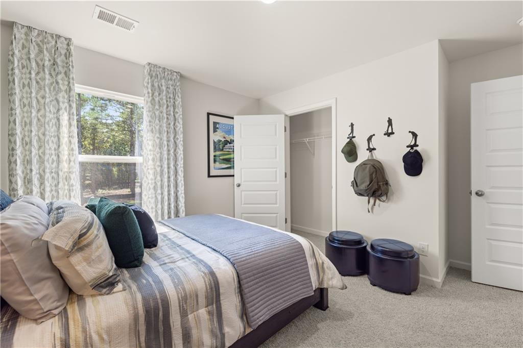 1191 Amerson Street Buckhead, GA 30625 - Photo 72 of 96 a bedroom with a large bed and a window