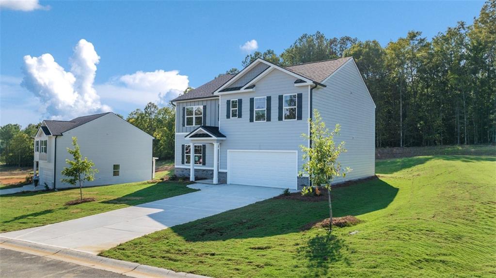 1191 Amerson Street Buckhead, GA 30625 - Photo 79 of 96 a front view of a house with garden