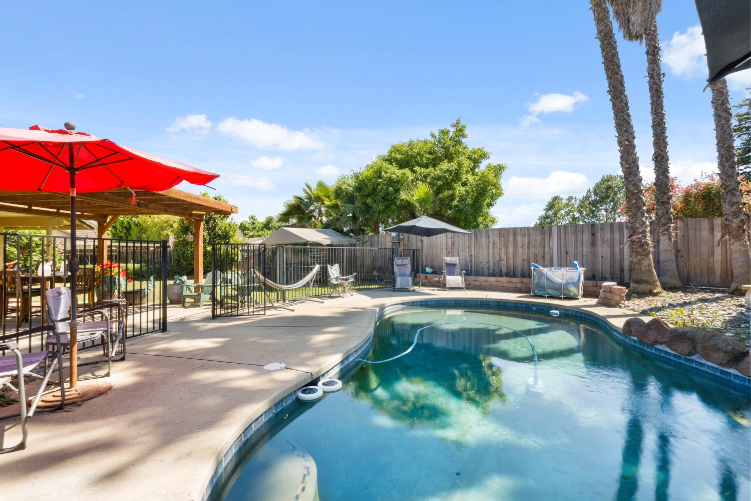 116 Fern Court Galt, CA 95632 - Photo 12 of 44 a view of a swimming pool with a patio