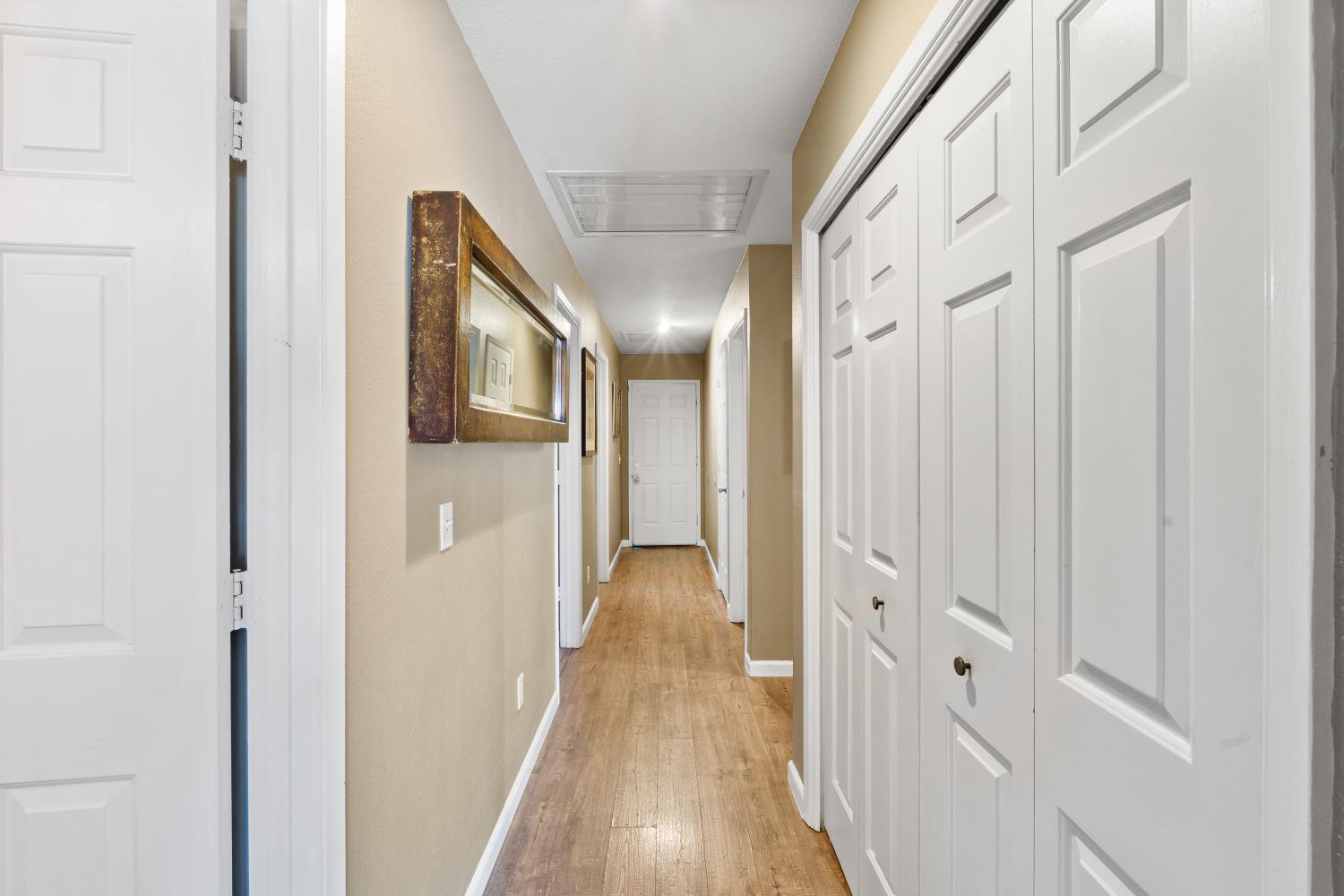 116 Fern Court Galt, CA 95632 - Photo 23 of 44 a view of a hallway with wooden floor