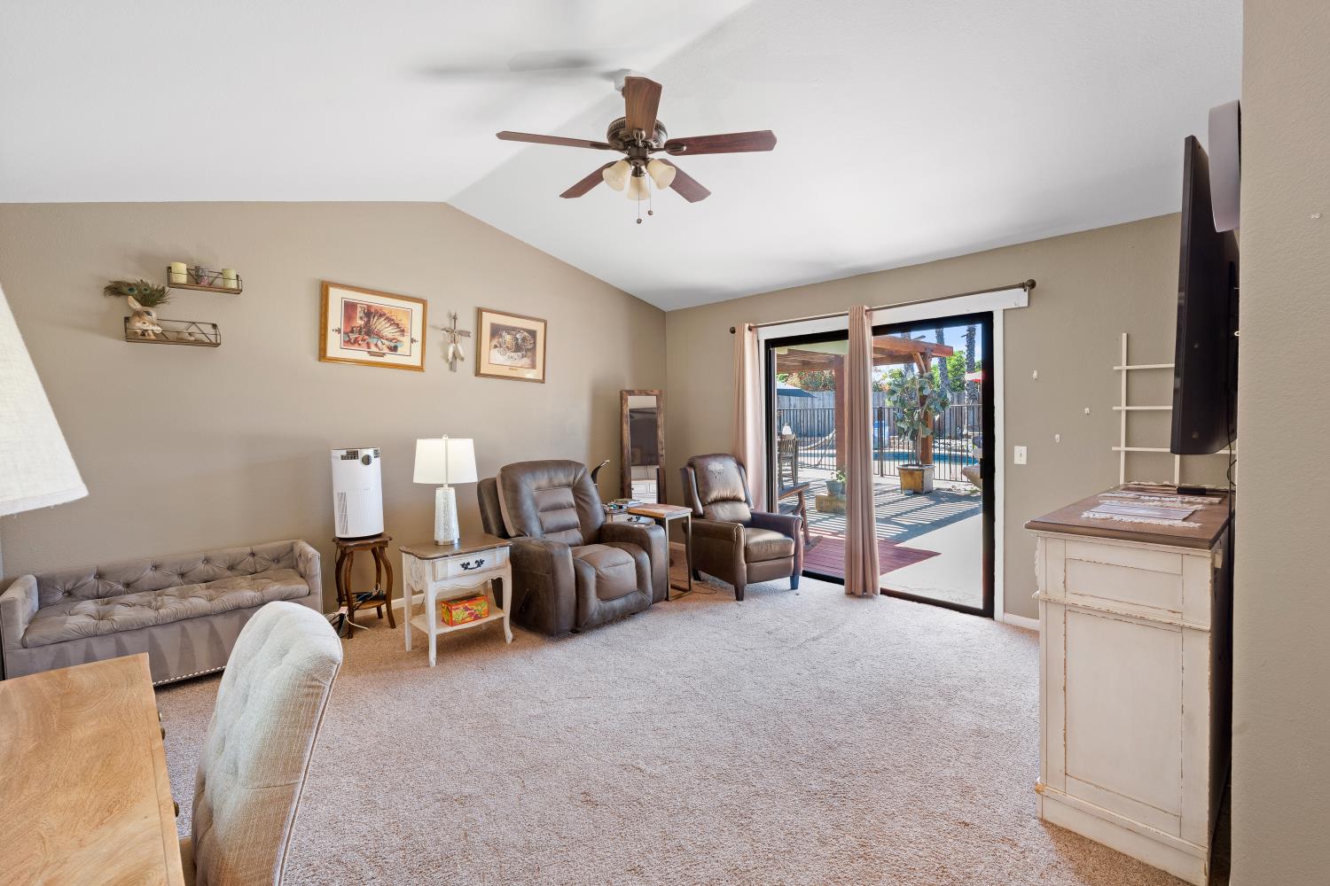 116 Fern Court Galt, CA 95632 - Photo 28 of 44 a living room with furniture and a chandelier