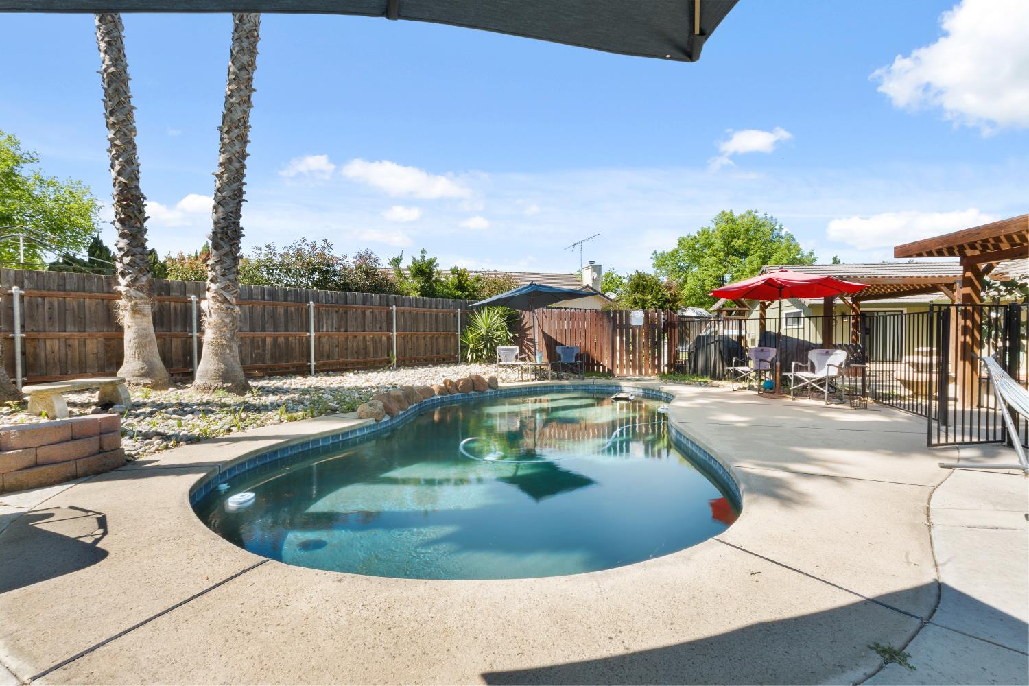 116 Fern Court Galt, CA 95632 - Photo 34 of 44 a view of a swimming pool with an outdoor seating