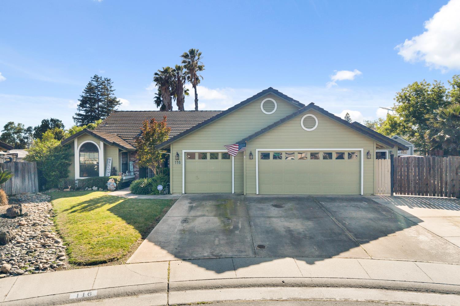 116 Fern Court Galt, CA 95632 - Photo 4 of 44 a view of a house with a yard and potted plants