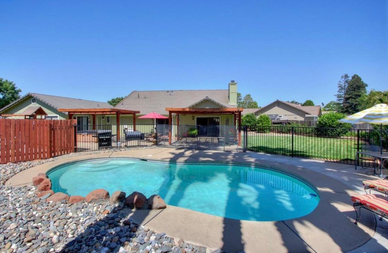 116 Fern Court Galt, CA 95632 - Photo 5 of 44 a view of a house with swimming pool and sitting area