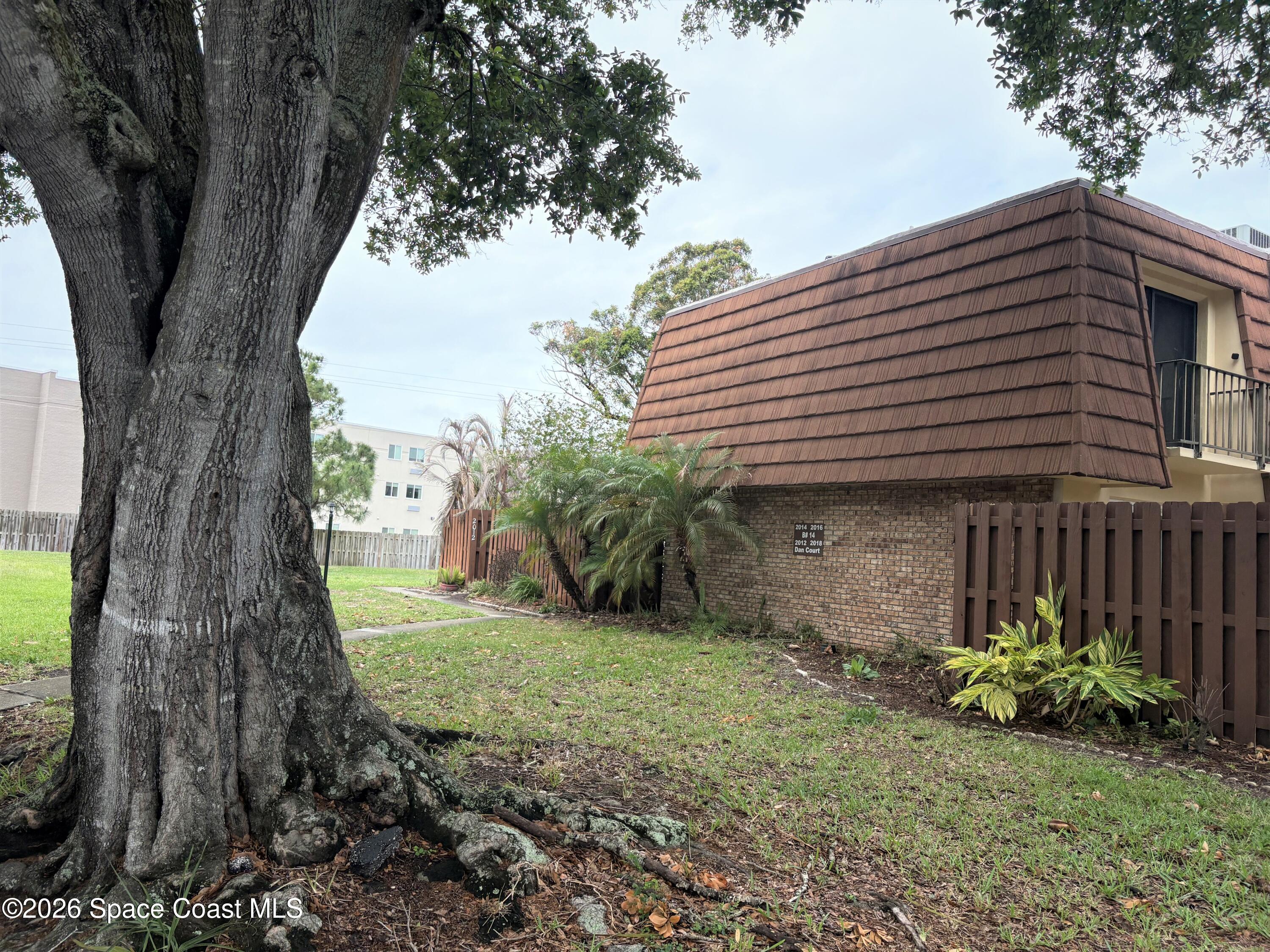 2012 Dan Court Palm Bay, FL 32905 - Photo 1 of 22 Front with oak tree