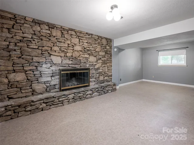 wooden floor in an empty room with a fireplace