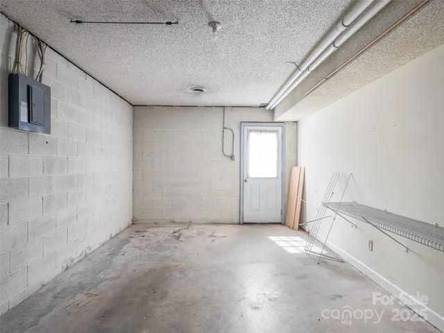 a view of a backyard with large trees