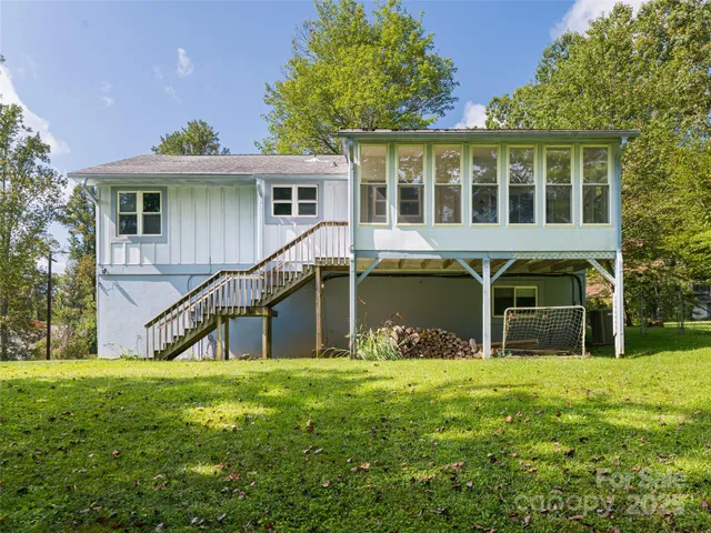 a view of swimming pool with outdoor seating and plants