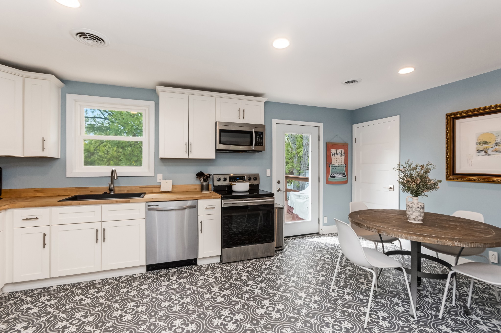 627 Hicks Road Nashville, TN 37221 - Photo 8 of 35 Tile Floor in Kitchen Along with SS Appliances, Butcher Block Counter Tops and Granite Farm Sink. Recessed lighting and access to large and spacious deck.